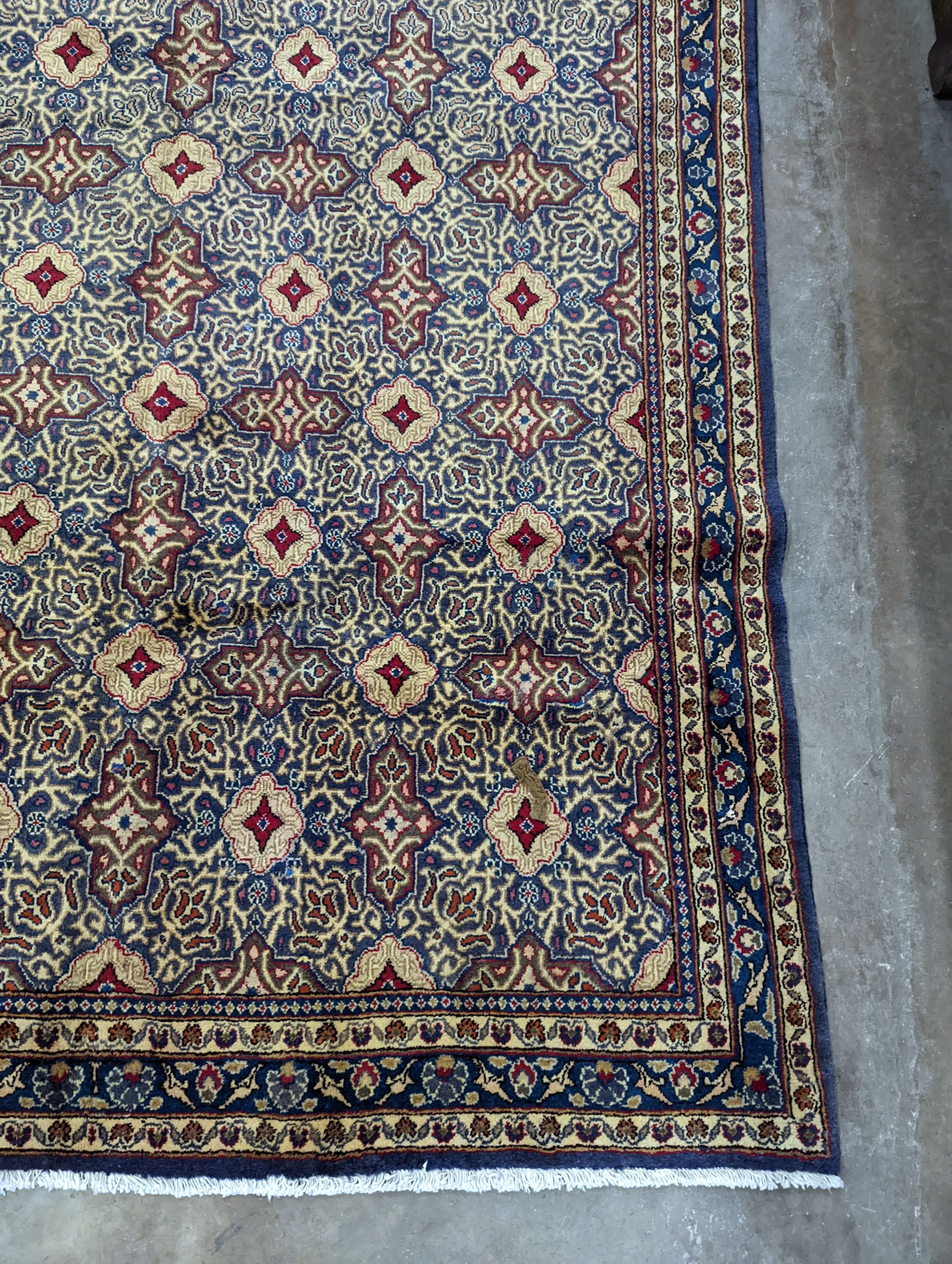 A meshed blue ground carpet, 290 x 190cm